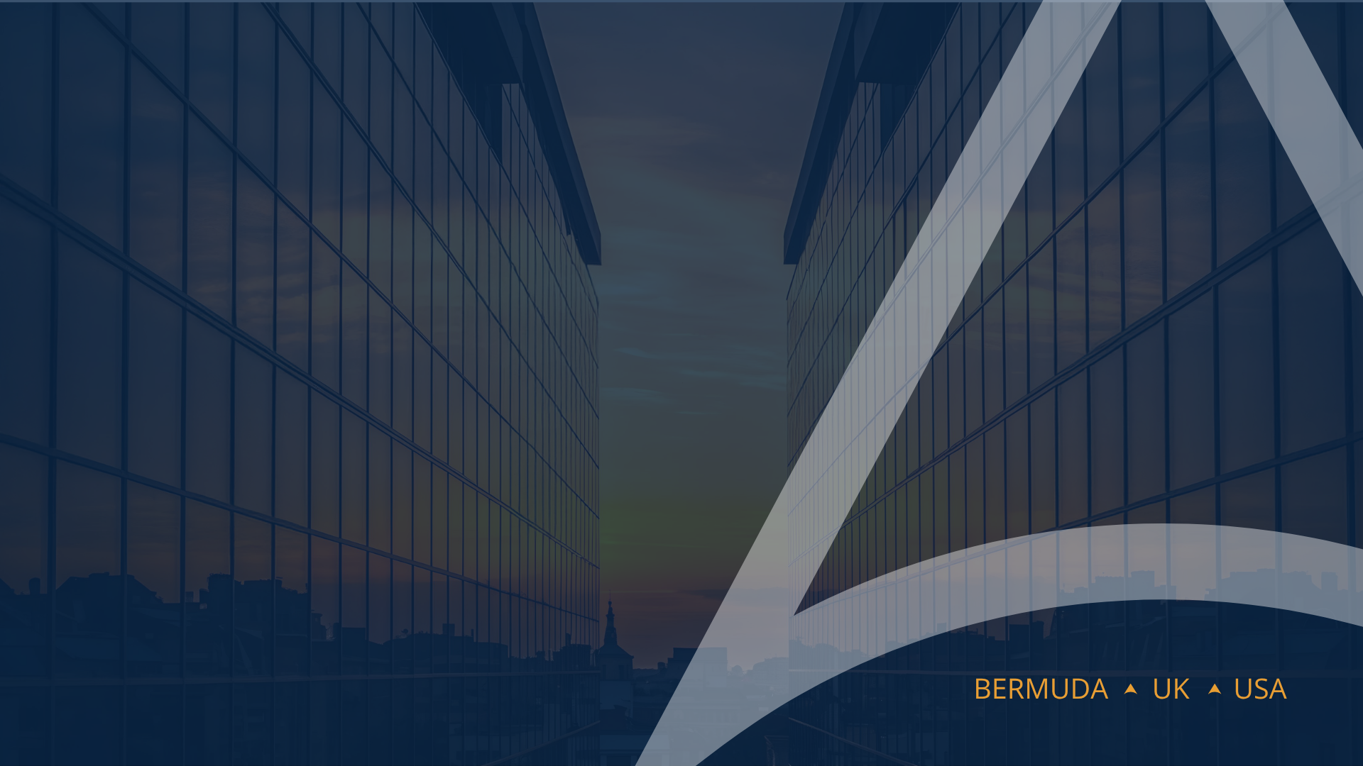 Modern glass office buildings with reflective windows, city skyline in the background, and a sunset sky behind the buildings. Text overlay reads 'BERMUDA ▲ UK ▲ USA'.