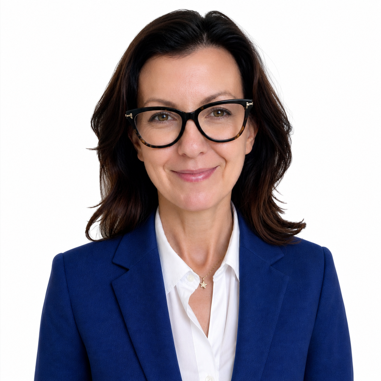 Heatehr Kitson. A woman with shoulder-length dark hair wearing glasses, a white shirt, and a blue blazer, smiling against a white background.