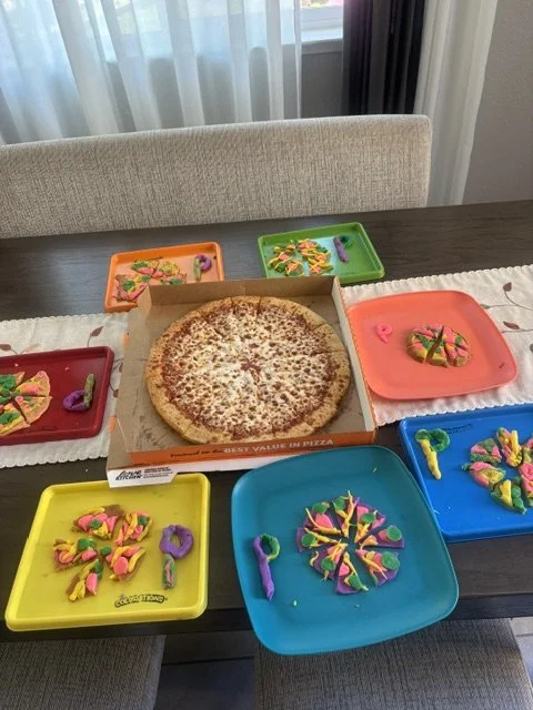 Preschool children creating colorful play dough pizzas during a letter P early literacy activity at BabeeShark Preschool in Sacramento