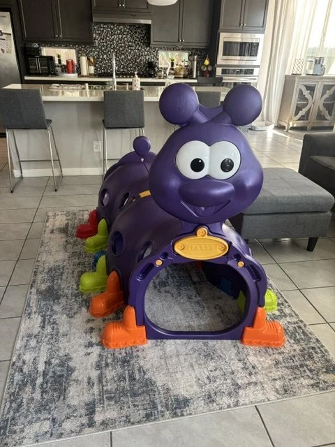 Indoor daycare play area with climbing structure and active play equipment for toddlers and preschoolers
