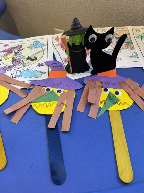 Preschool Halloween witch crafts made by children during a letter W alphabet learning activity at BabeeShark Preschool in Sacramento.