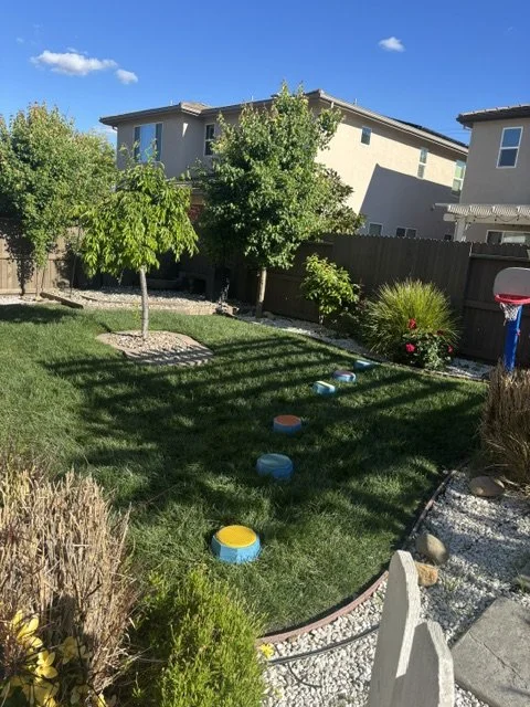 Large outdoor preschool play area with open space for active learning and play