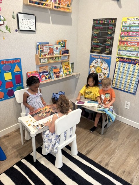 Preschool classroom with educational toys, play kitchen, and hands-on learning centers