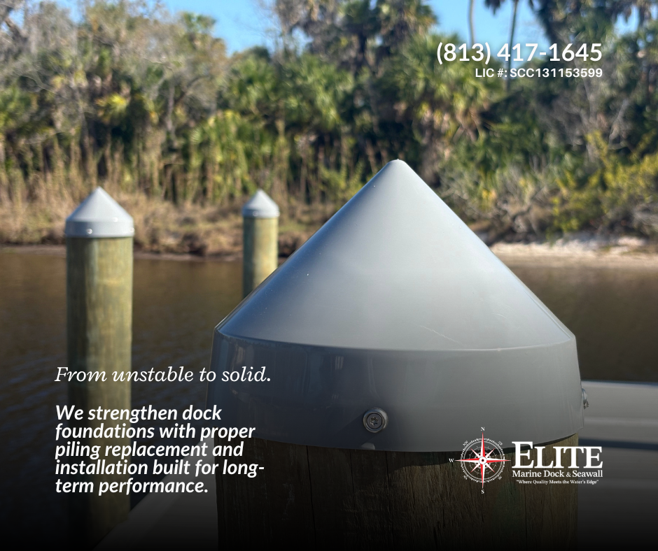 Close-up of a boat dock piling with a cone-shaped metal cap, in a marina with water and trees in the background.