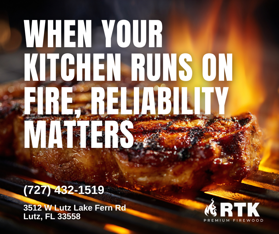 A close-up of a steak grilling on an open flame with the text "When your kitchen runs on fire, reliability matters" and contact information for RTK Premium Firewood in Lutz, Florida.