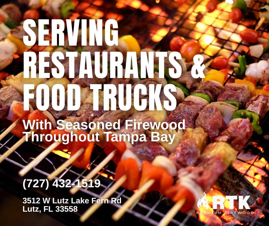 Close-up of skewers with grilled meat and vegetables on a firewood grill, advertising serving restaurants and food trucks in Tampa Bay with seasoned firewood.