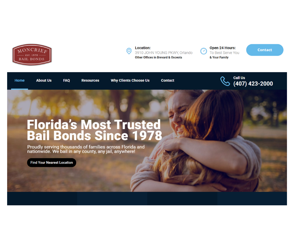 Homepage of a bail bonds website with a logo, contact information, and a large image of two women hugging outdoors.
