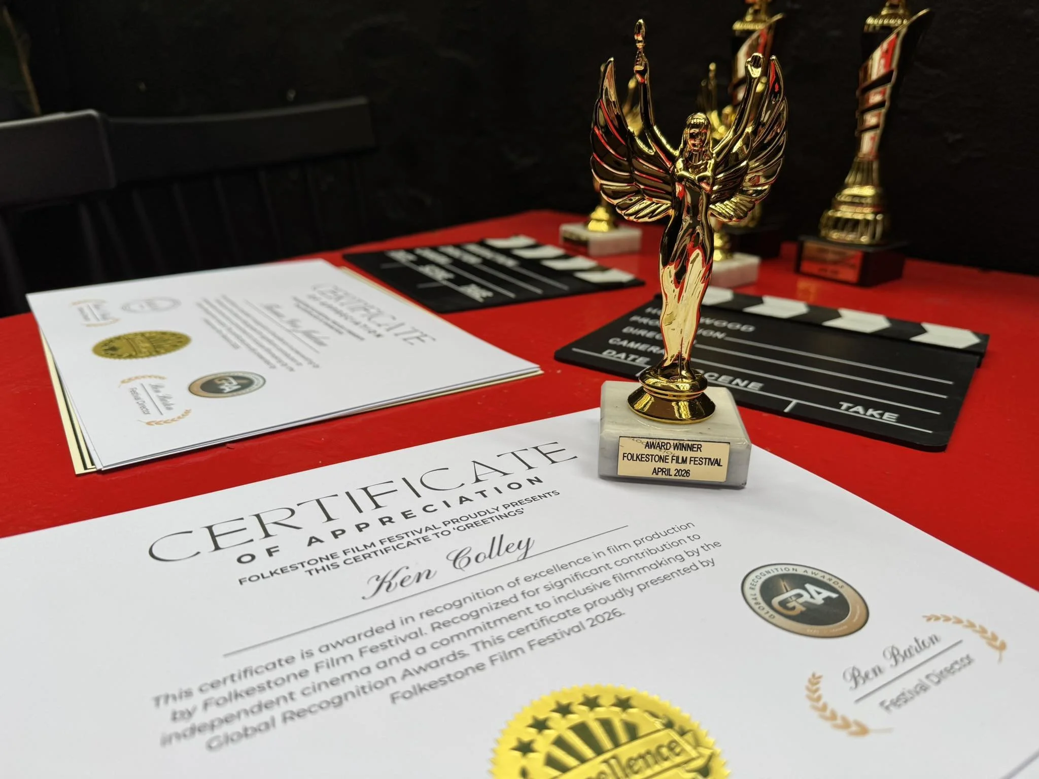 Trophies and certificates on a table