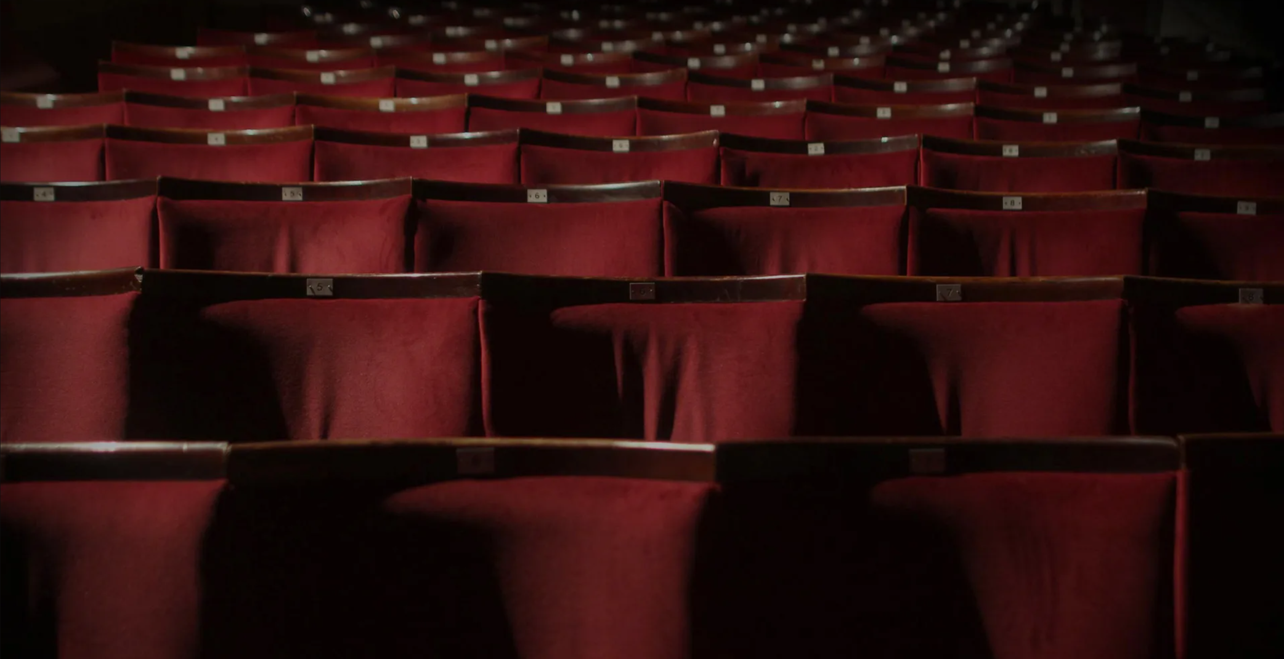 Red velvet seats in a vintage style cinema