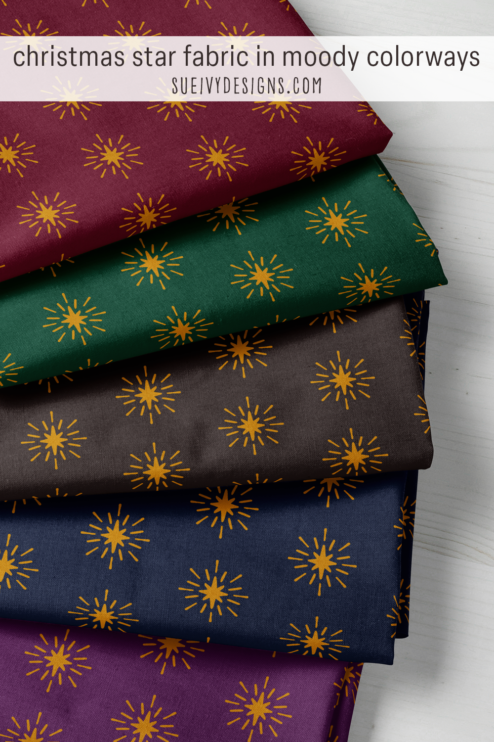 Gold eight-pointed stars with light rays on five dark grounds — wine, forest green, navy, purple, and warm black — for a starry Christmas quilt.