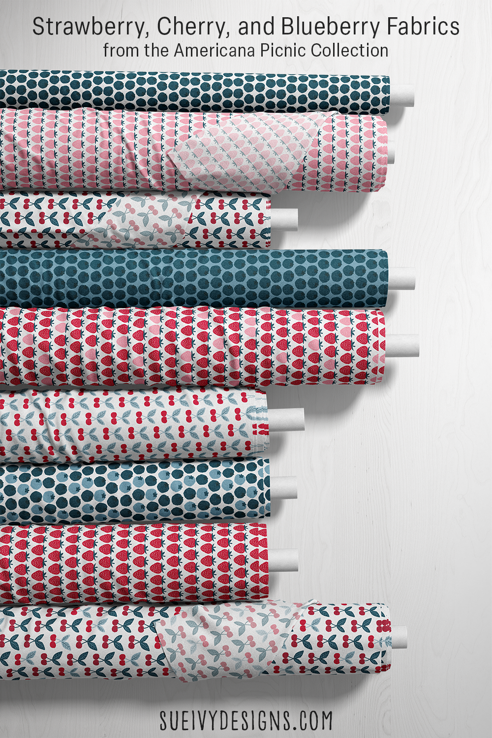 nine rolls of strawberry, cherry, and blueberry fruit fabric by Sue Ivy Designs