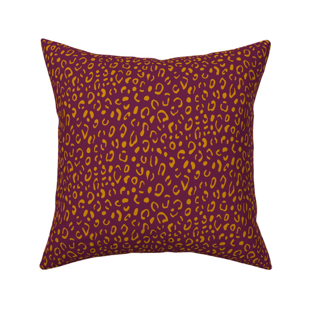 Dark plum abstract leopard print throw pillow, a jewel-toned fall home decor accent.