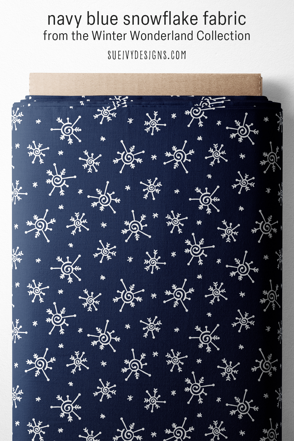 Navy blue snowflake fabric, white doodled snowflakes tossed across a navy ground, for winter home decor and quilting.