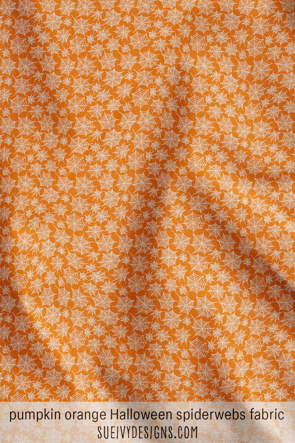 Pumpkin orange Halloween spiderwebs fabric with delicate hand-drawn cobwebs, a bright blender for a not-too-spooky Halloween quilt or table runner.