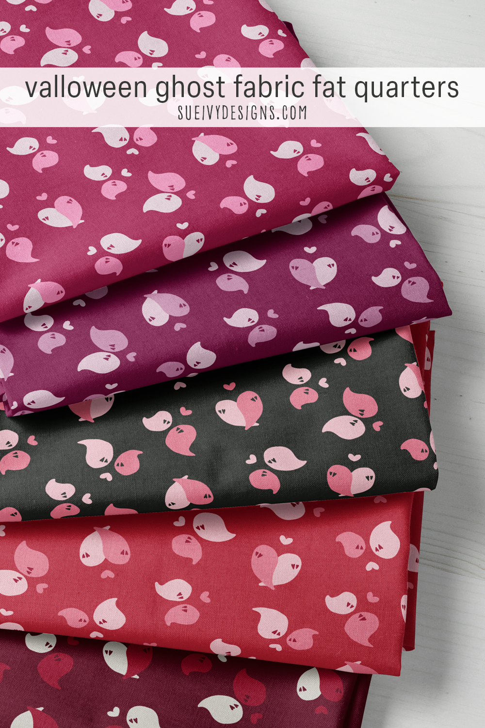 Heart-eyed ghosts in pairs under floating hearts, fat quarters in five colorways including pink & black and red & wine, for a lap quilt