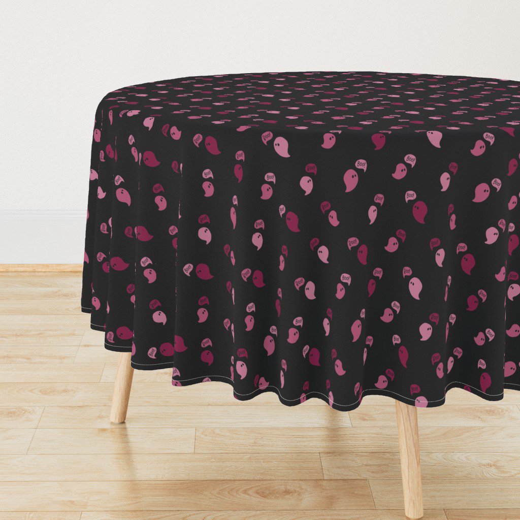 Round black Halloween tablecloth scattered with plum and mauve ghosts and boo word bubbles, sewn from the Happy Haunting hero print.