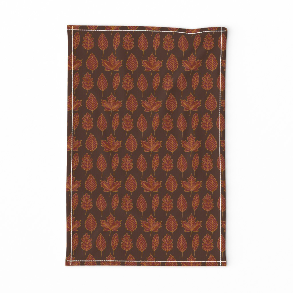 Burgundy and gold fall leaf fabric sewn into a tea towel.