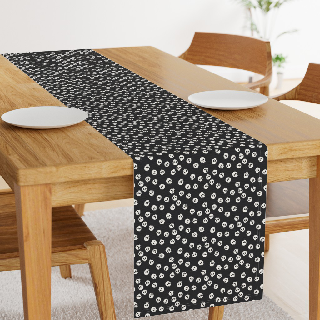 Light gray skulls on black Halloween table runner made from Spooktacular tossed skulls fabric