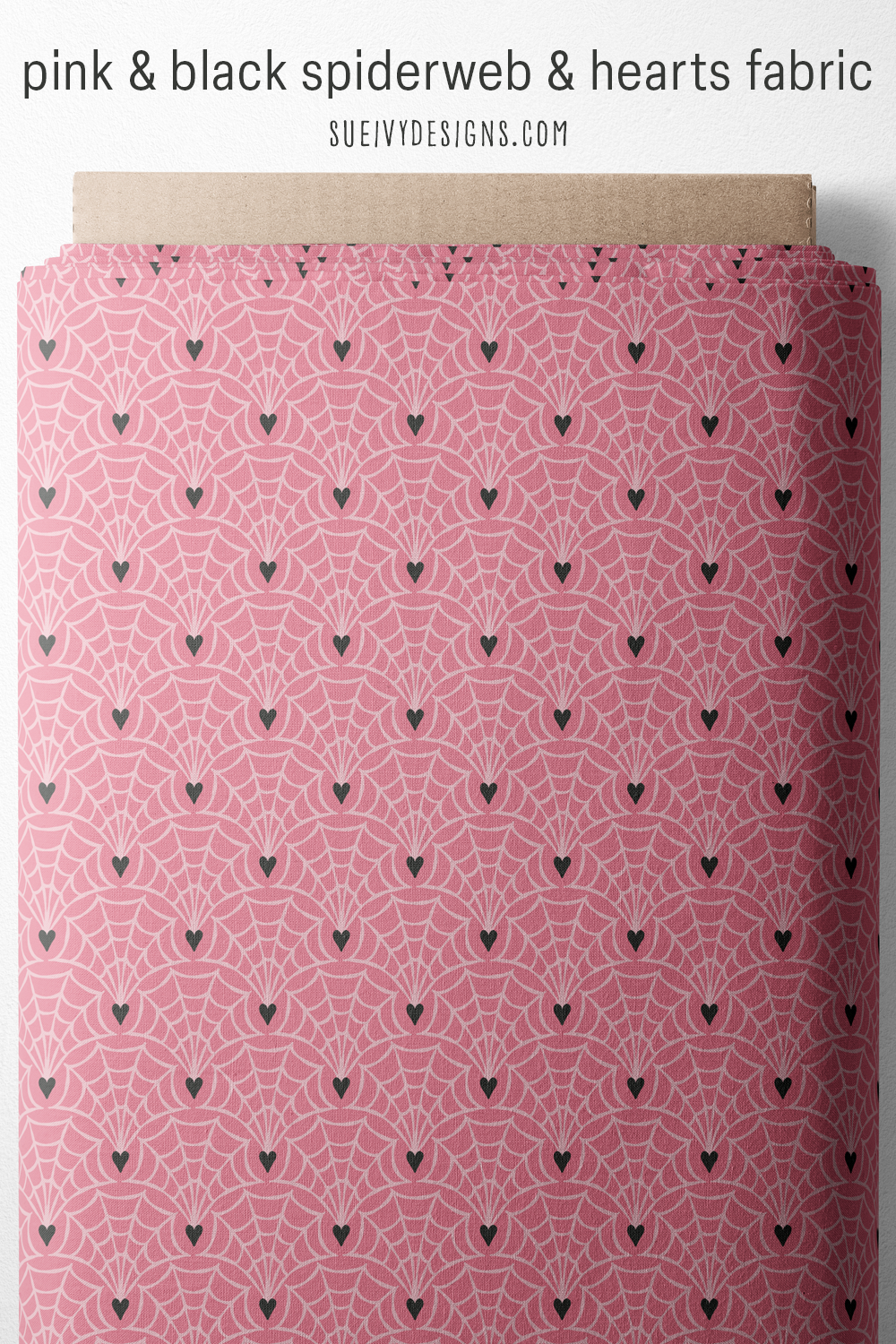 Light pink webs fanning up from soft black hearts on peachy pink, rolled on a bolt, for a pink goth bag