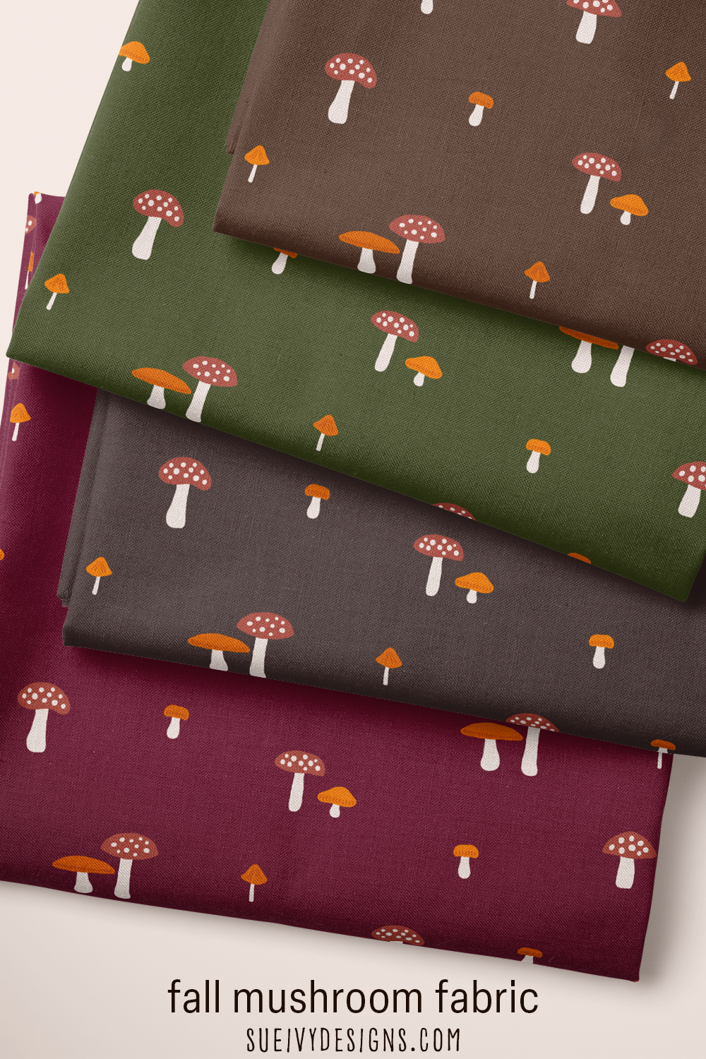 Fall mushroom quilting fabric from the Snails & Mushrooms autumn collection by Sue Ivy Designs, toadstool mushrooms scattered across dark autumn backgrounds.