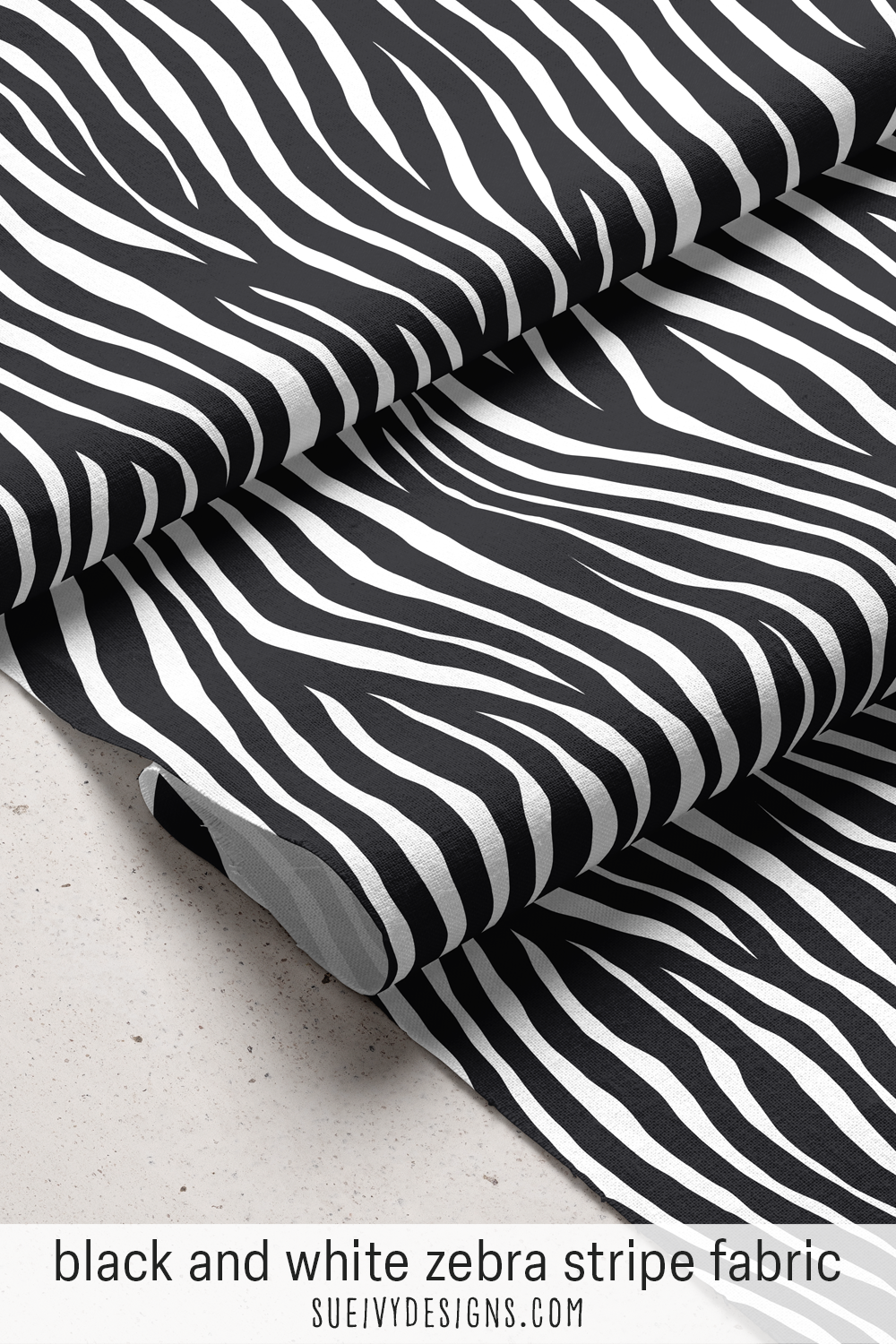 Large-scale zebra stripe fabric in black and white — crisp, high-contrast animal print in a bold neutral, for apparel.
