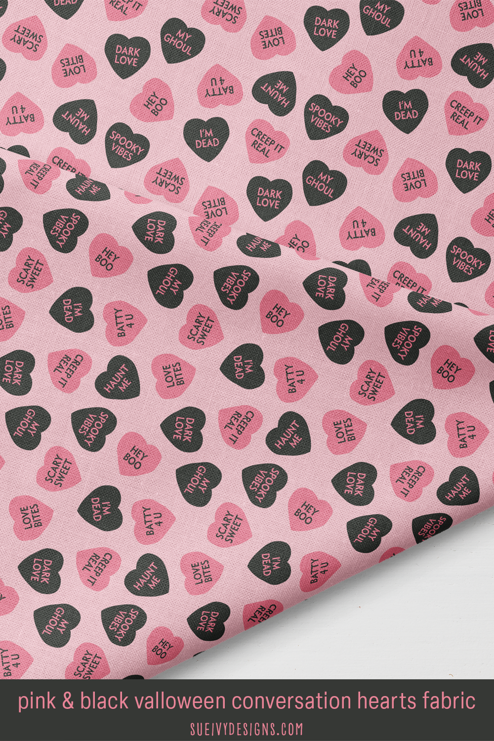 Soft black and peachy pink candy hearts saying dark love and love bites on light pink, for a pinkoween skirt