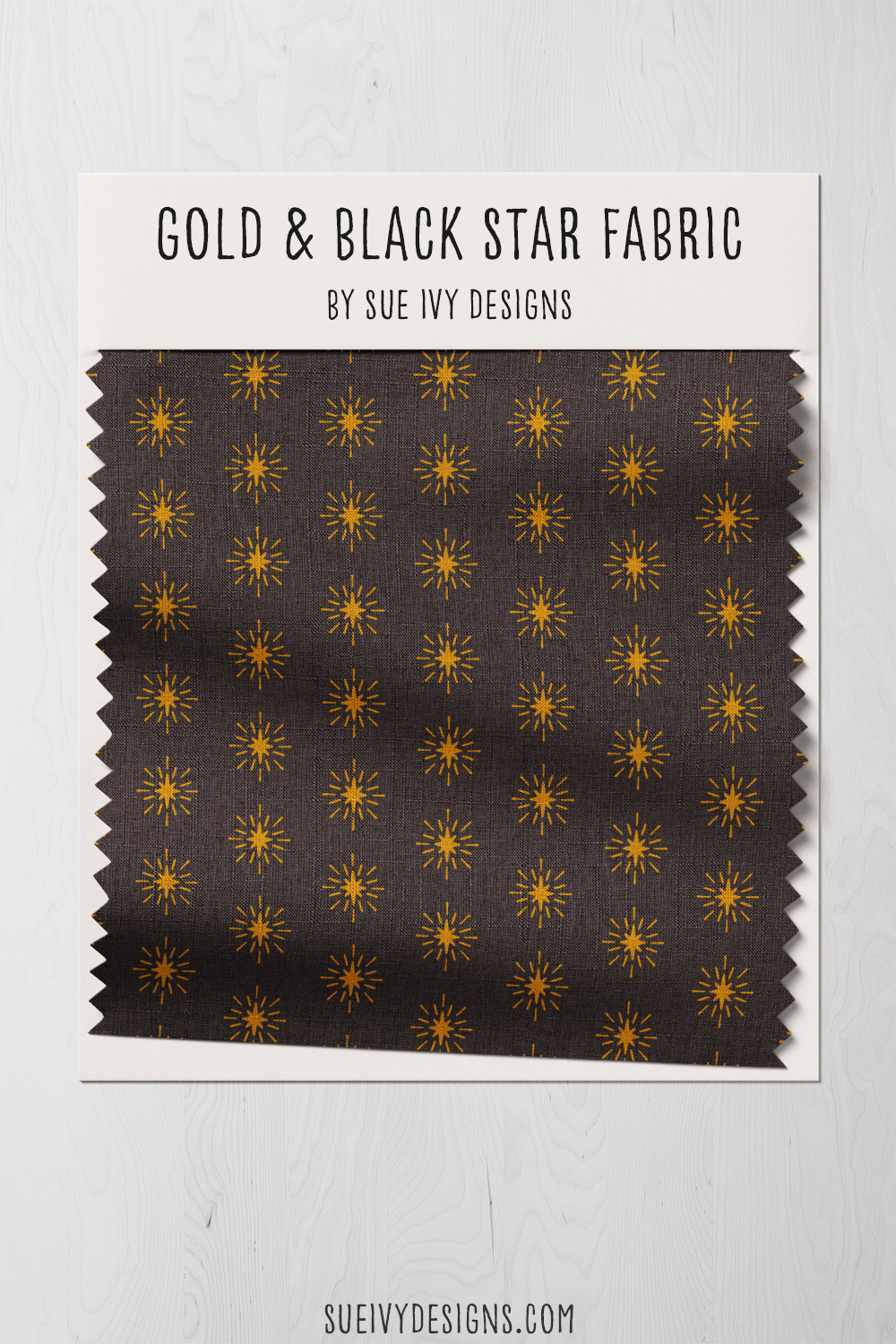Warm-black celestial star swatch, one gold eight-pointed star bursting with light — for holiday stockings.