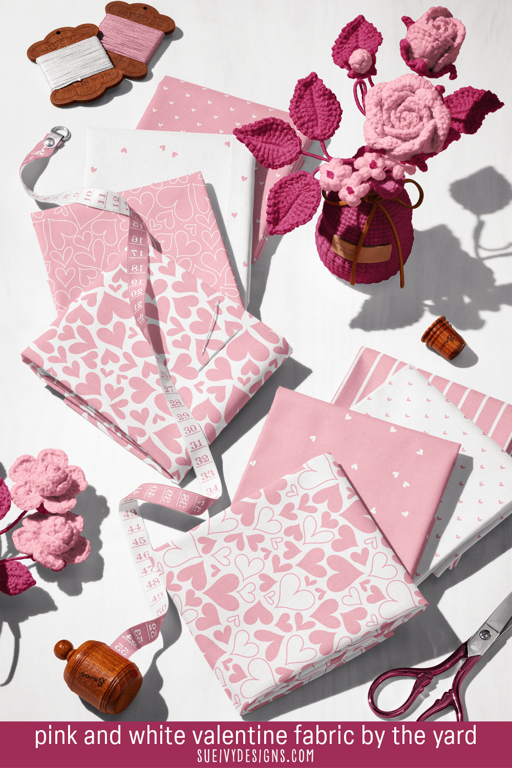 Light pink and white hearts and stripes, eight fat quarters beside crochet roses, for baby shower bunting.