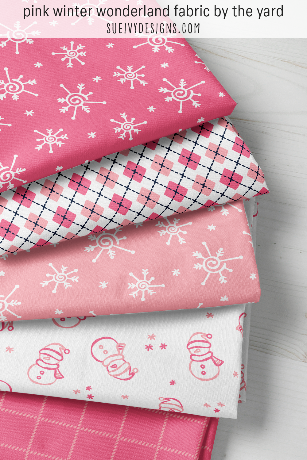 Pink winter fabric — five Winter Wonderland fat quarters in light coral pink and dark candy pink for colorful quilting.