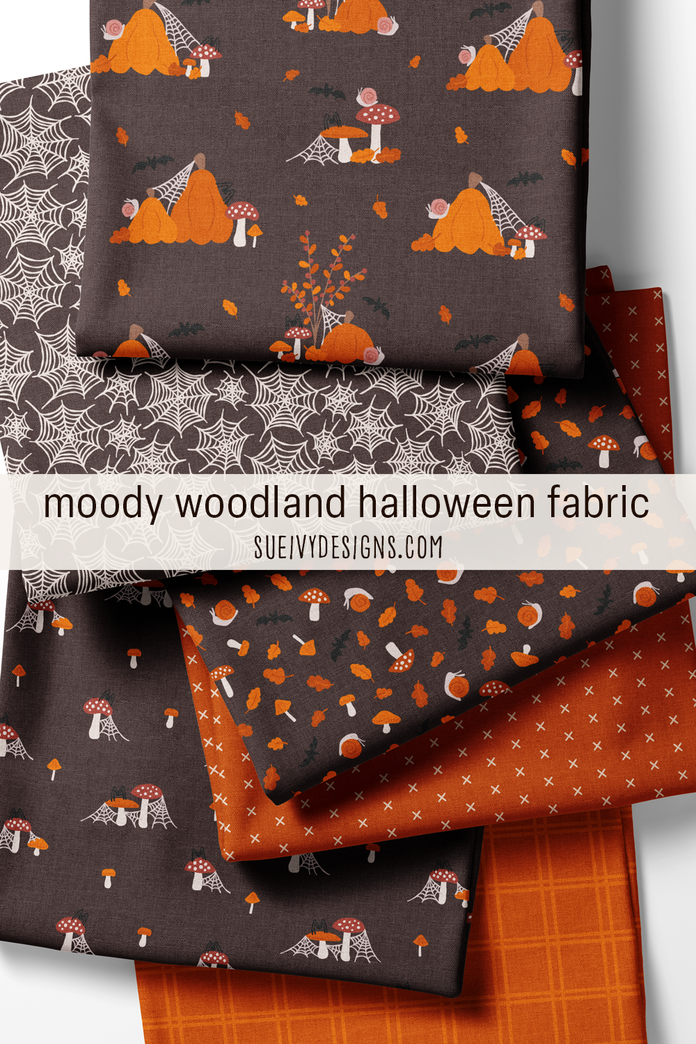 A folded & fanned fat quarter stack of moody woodland Halloween prints on warm black and dark orange grounds, for Halloween sewing.