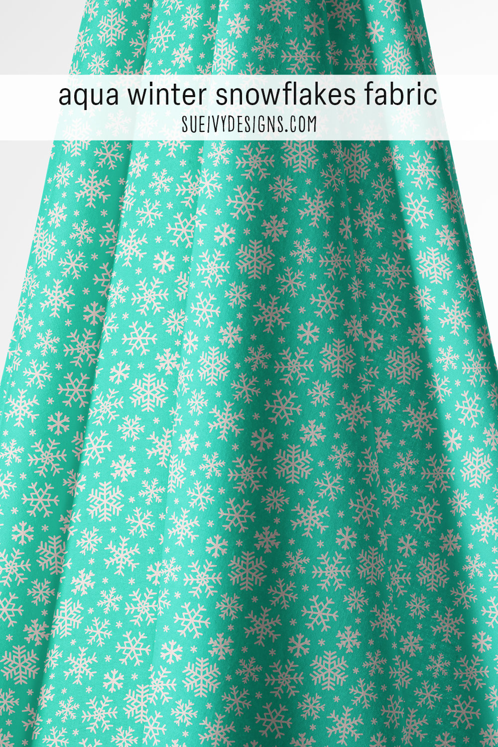 Cream chunky snowflakes tossed on an aqua blue ground — winter home decor fabric.