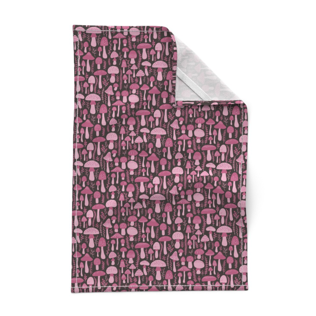 Tea towel in the mushroom and botanical print, raspberry purple mushrooms and poison berries on black.