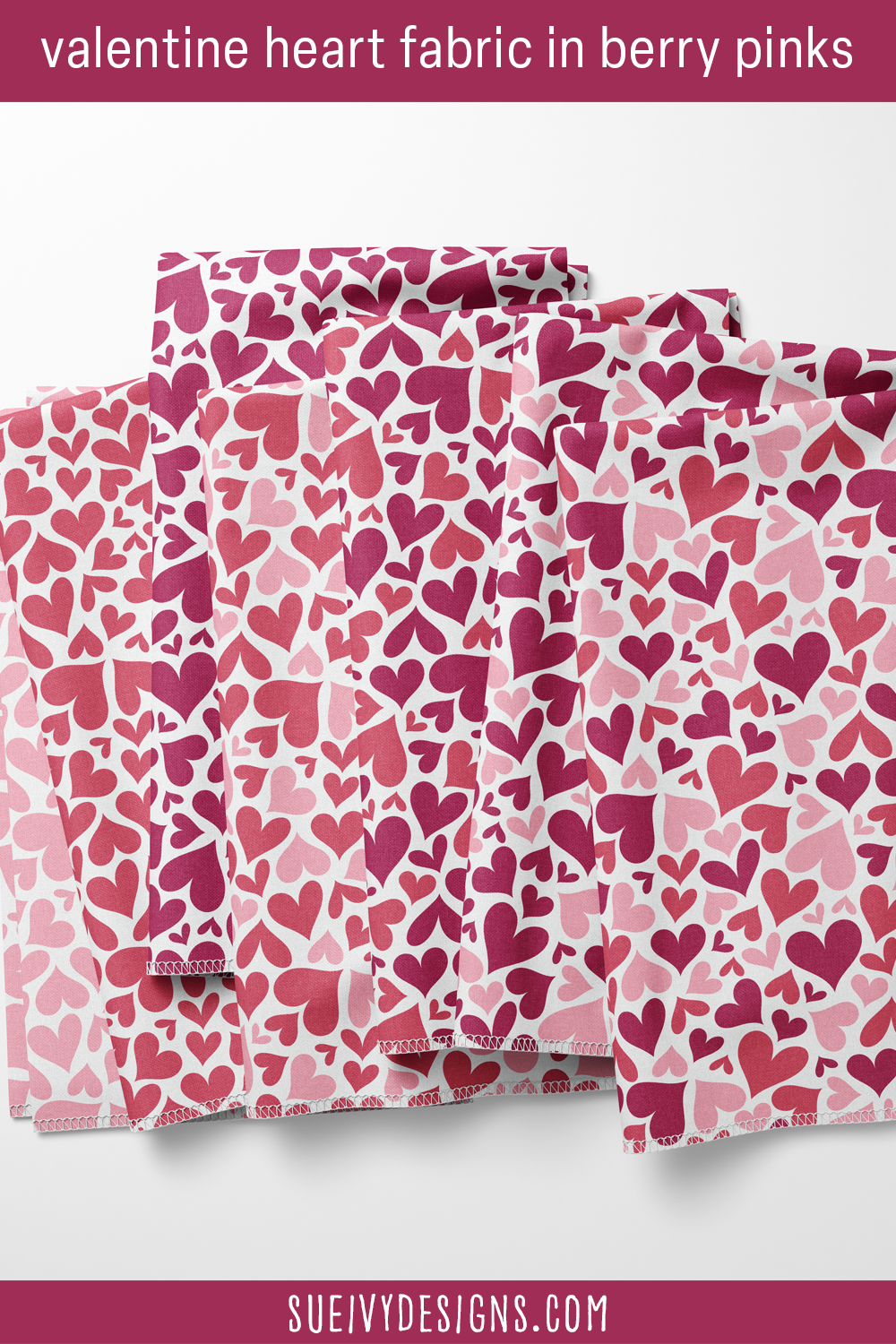 Fanned fat quarters of puffy solid hearts in all seven colorways, multicolor down to one-color light pink, for cloth napkins.