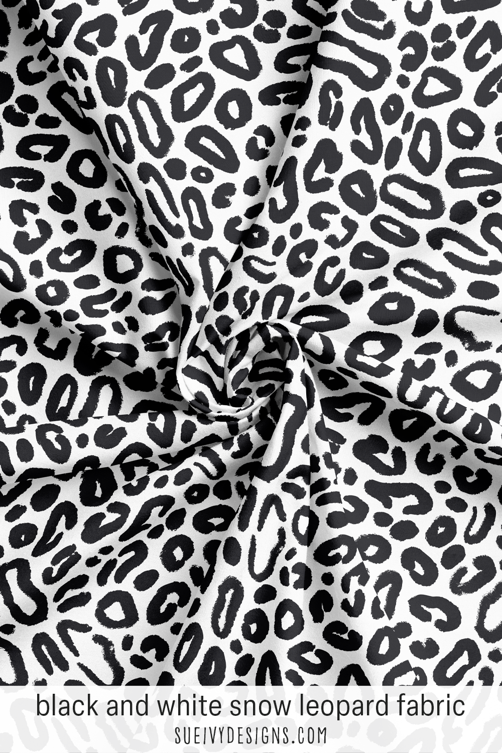 Oversize snow leopard fabric in black and white — bold, high-contrast spots, an animal print for statement home decor or apparel.