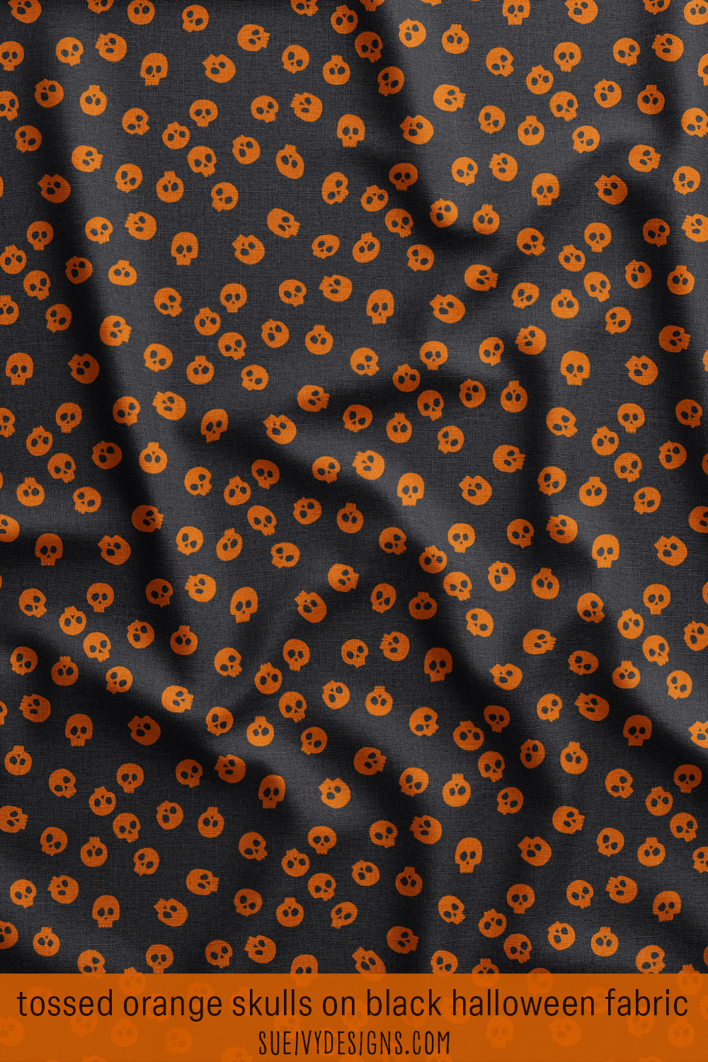 Burnt orange tossed skulls on black Halloween fabric from the Spooktacular collection by Sue Ivy Designs