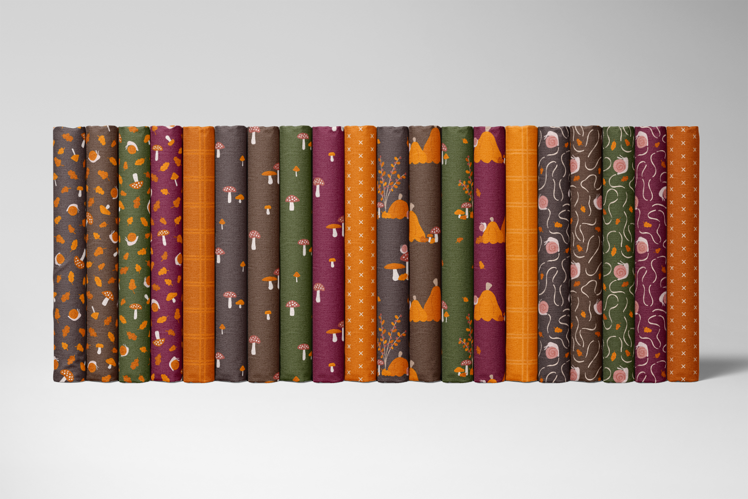 Fall sampler from the Snails & Mushrooms autumn fabric collection by Sue Ivy Designs, showing the autumn prints in burnt orange, dark forest green, coffee brown, warm black, and dark wine.