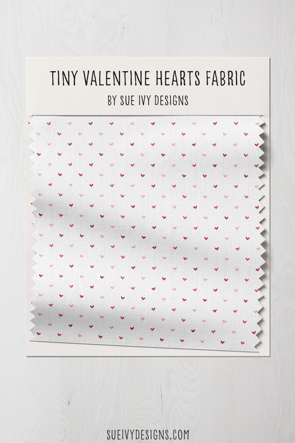 Multicolor tiny hearts in tilting rows on white, a swatch card for a baby burp cloth.