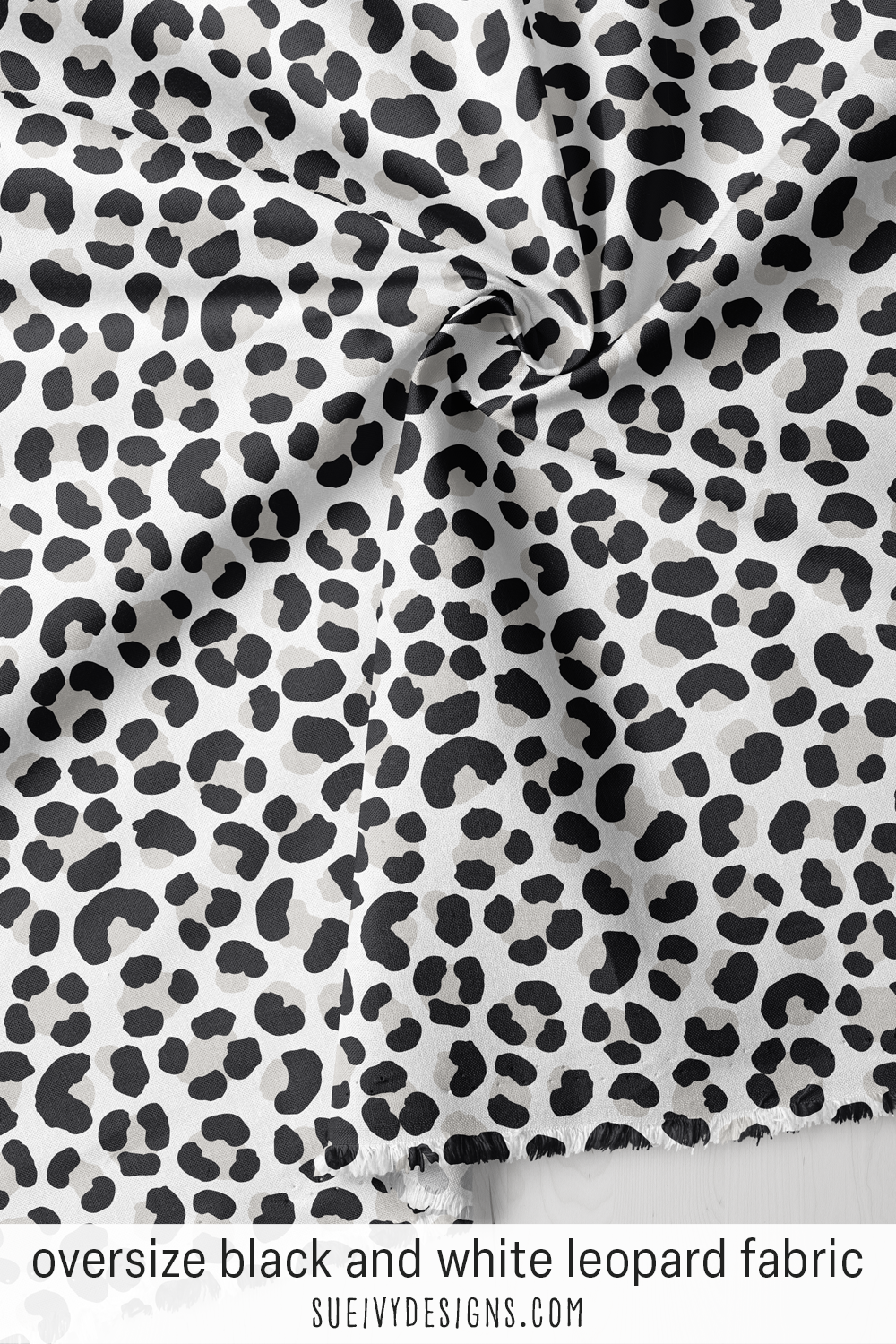 Oversize leopard fabric in black and white — bold, large-scale spots, a striking neutral animal print for bags and totes.