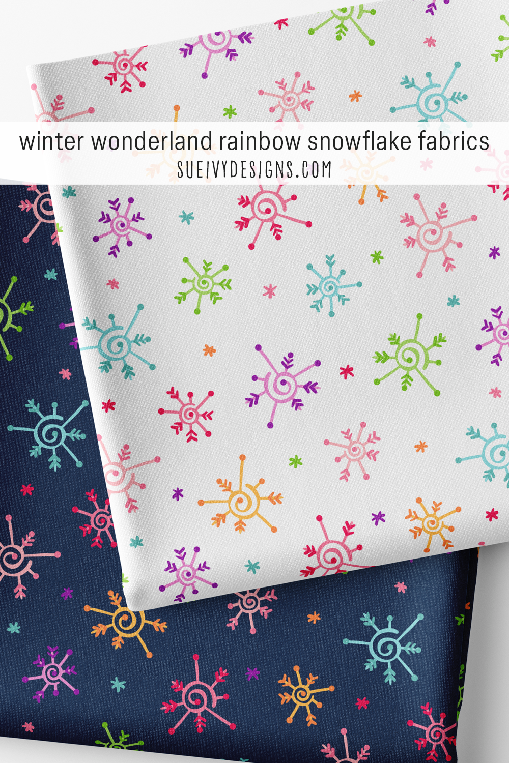 Rainbow snowflake fabric shown on white and navy — multicolor doodled snowflakes for colorful winter quilting and apparel.