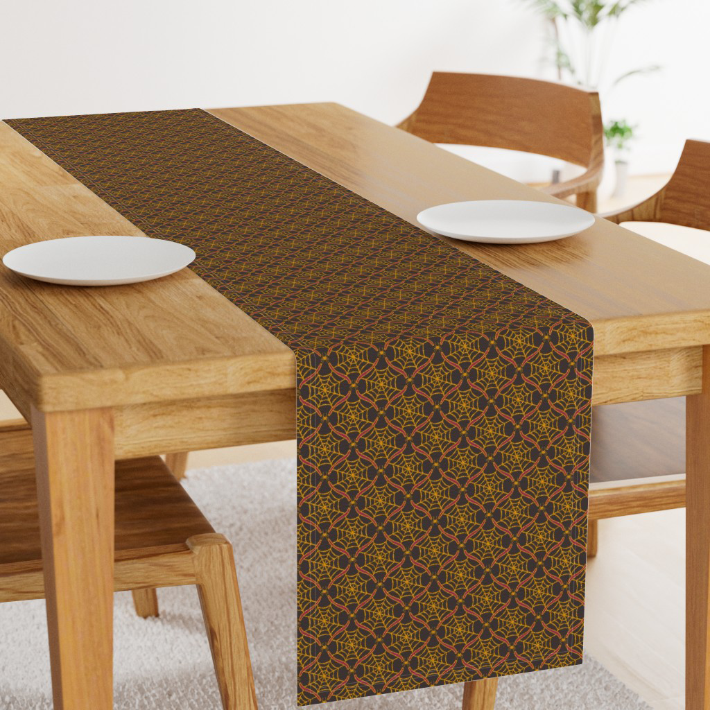 Gold and dark raspberry purple spiderweb ogee table runner, styled for a witchy Halloween table setting.