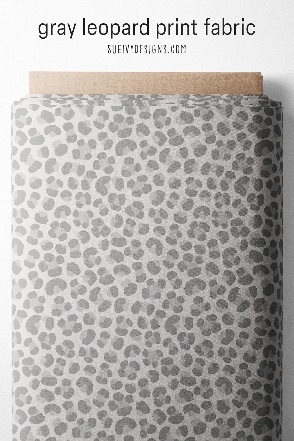 Gray leopard fabric on the bolt — soft tonal spots in a low-contrast neutral animal print, for quilting and home decor.