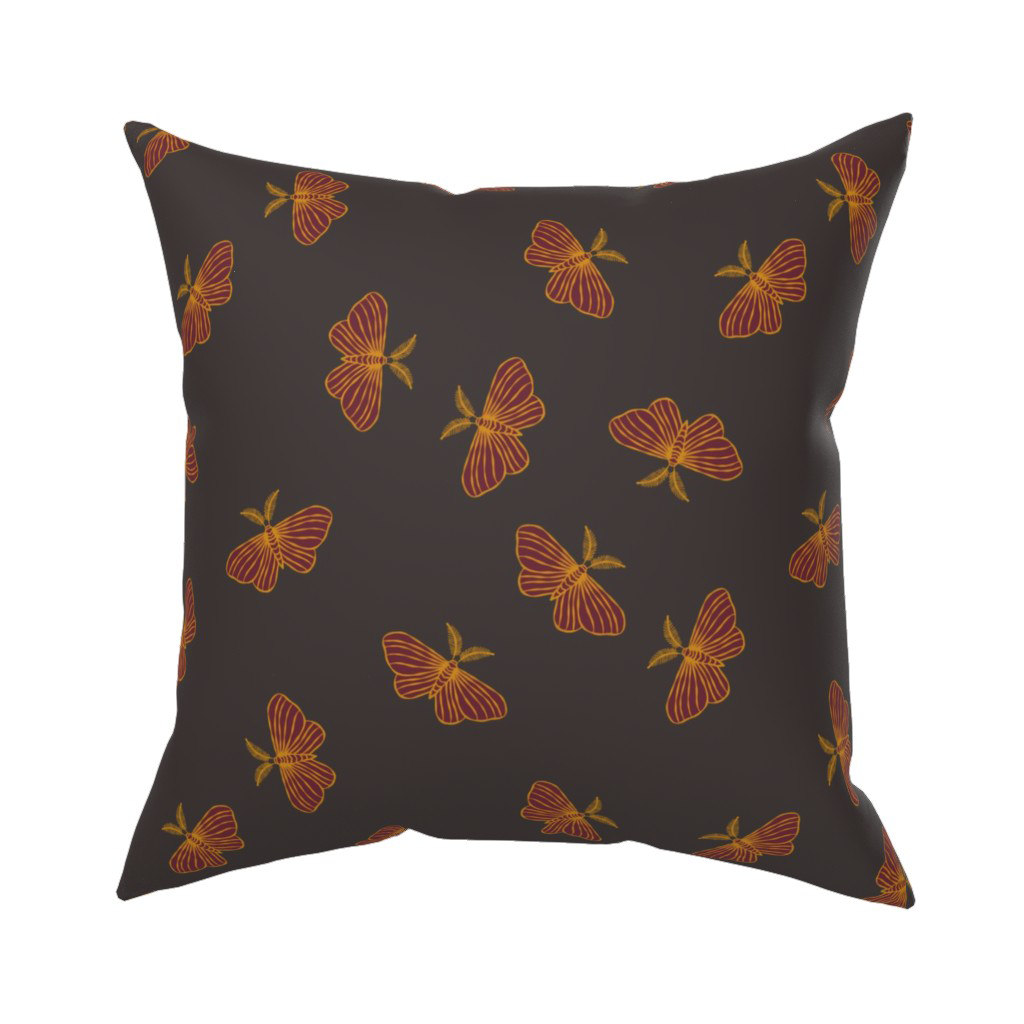 Gold and dark wine tossed moth throw pillow, a nighttime-garden accent for a Halloween-ready couch.