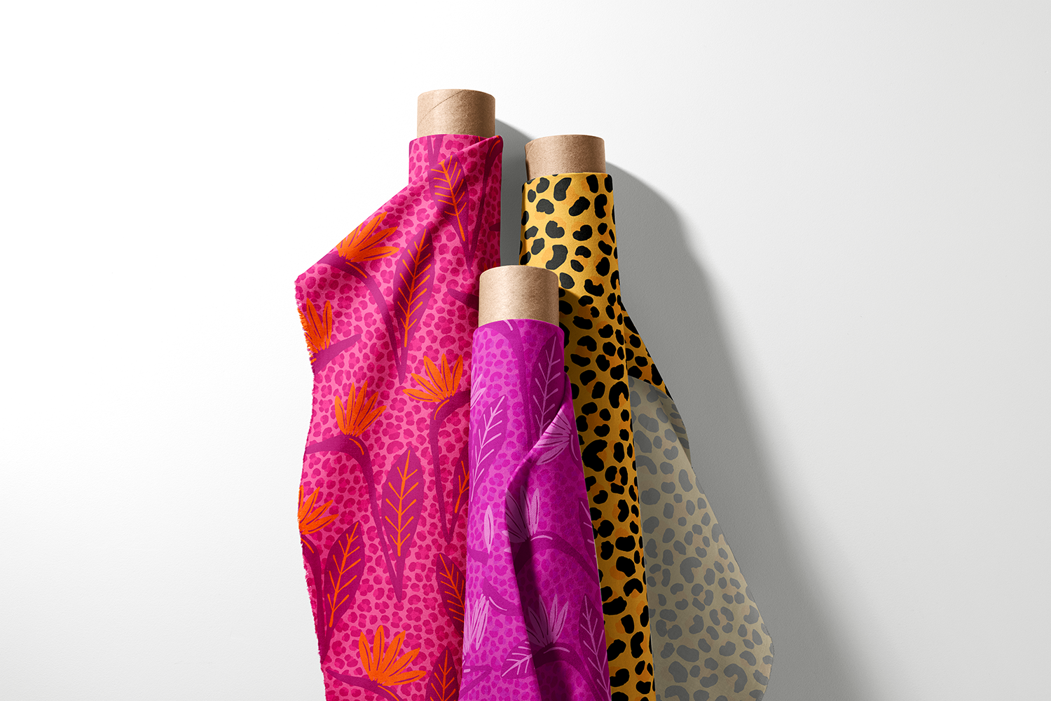 Three rolls of tropical floral and leopard spot fabric from the Tropical Jungle Summer collection by Sue Ivy Designs