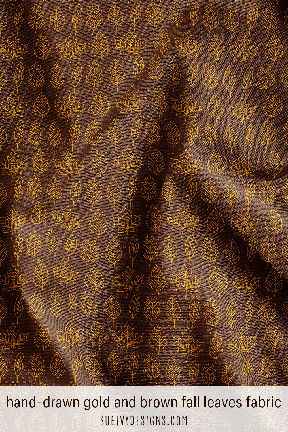 Detailed hand-drawn maple, oak, & fall leaves in gold outlines on dark brown fabric.