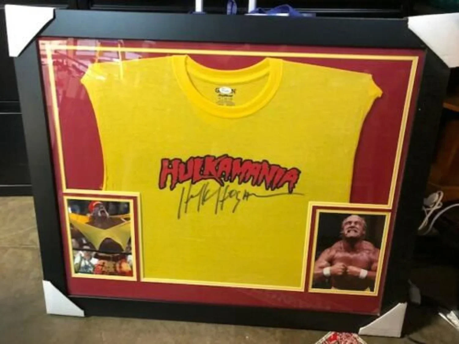Framed wrestling memorabilia featuring a yellow T-shirt with the word 'Hulknama' in red, signed autographs,  custom framing brookline pictureplacebrookline.com