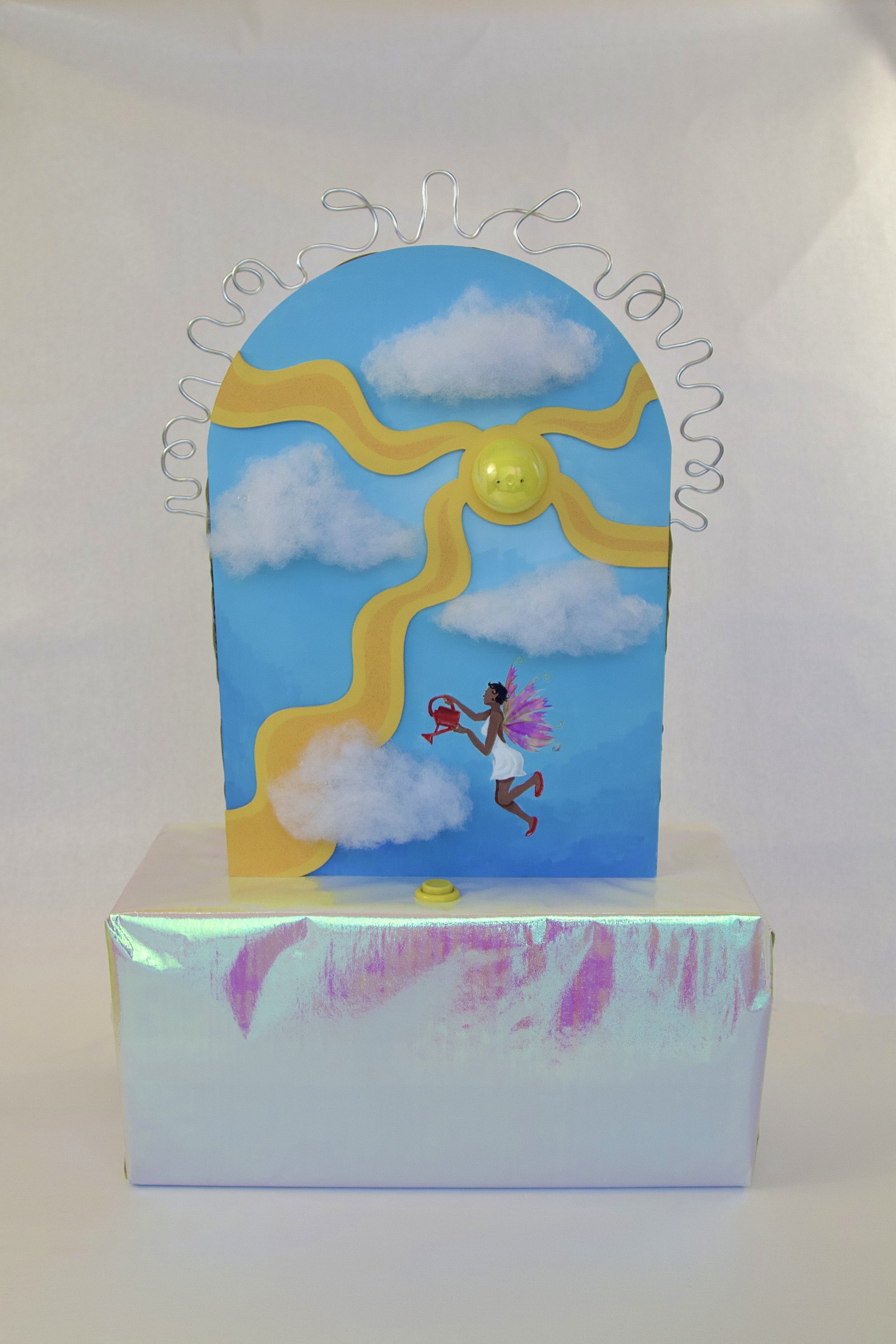Hologram unicorn with rainbow-colored wings and a rainbow-colored tail, floating above an iridescent box.