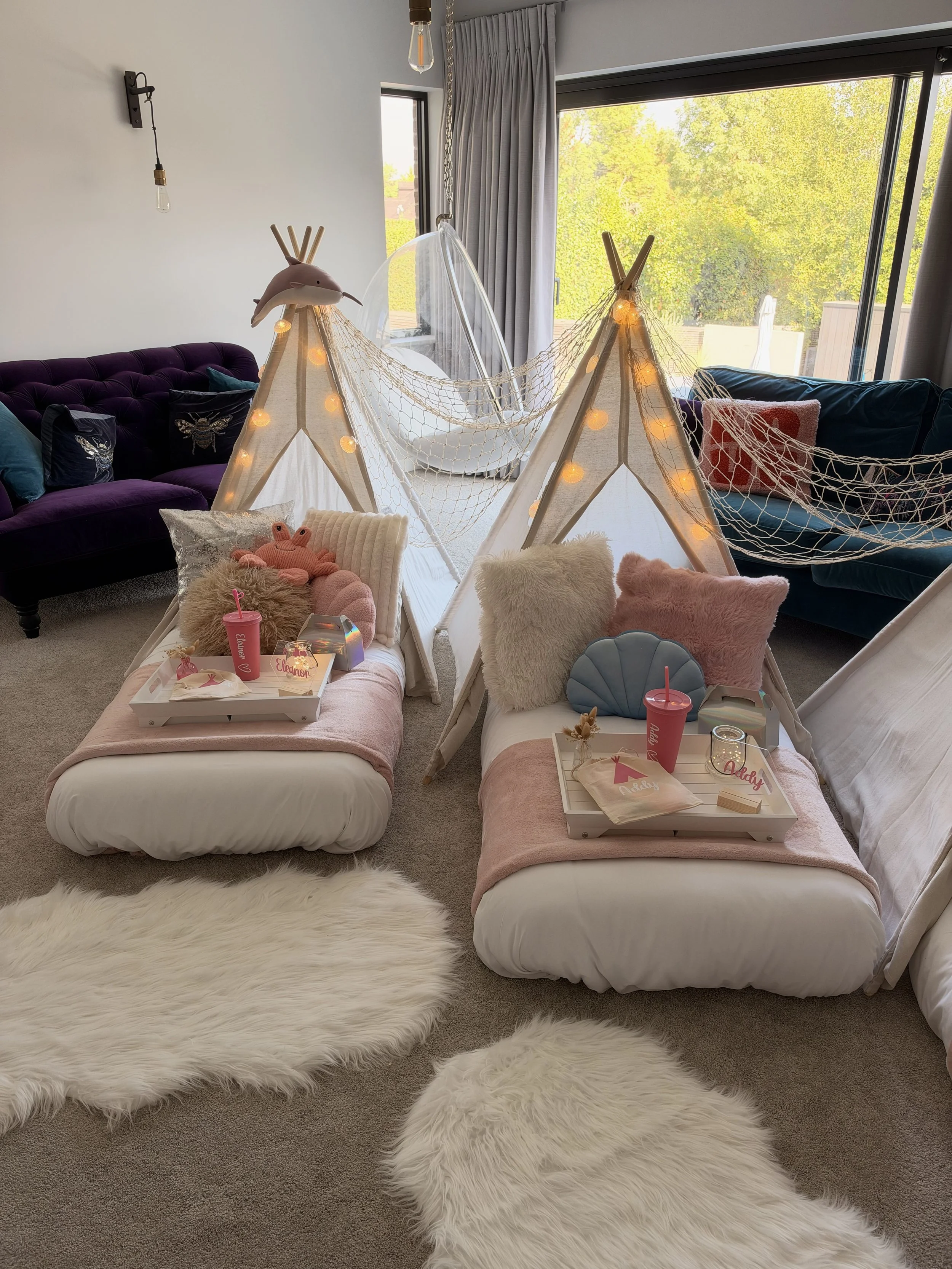 Mermaid teepee sleepover party hire in Hampshire with shell cushions, personalised trays and fairy lit teepees