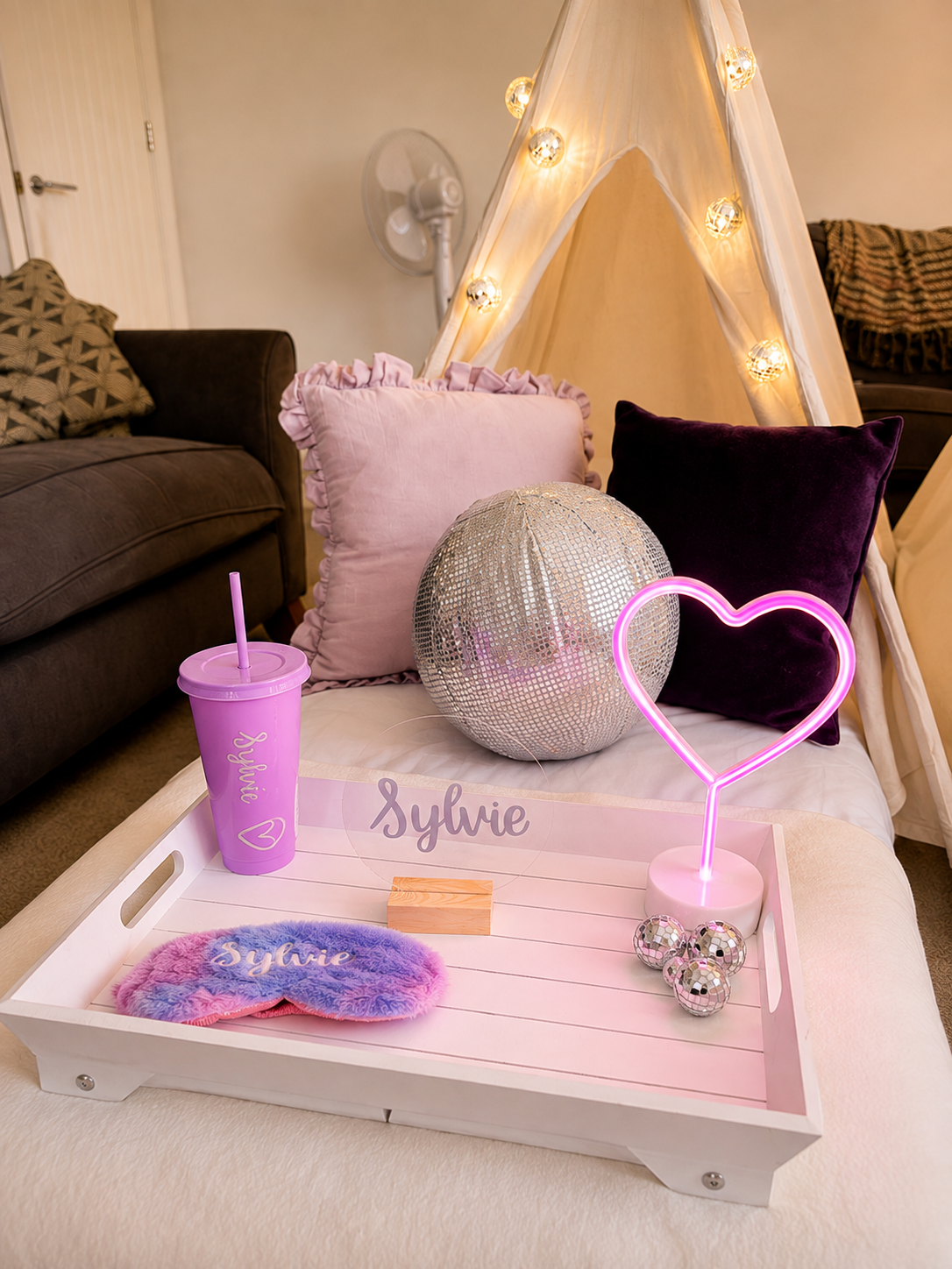 Personalised disco sleepover tray with pink heart light, disco ball cushion and sleep mask.