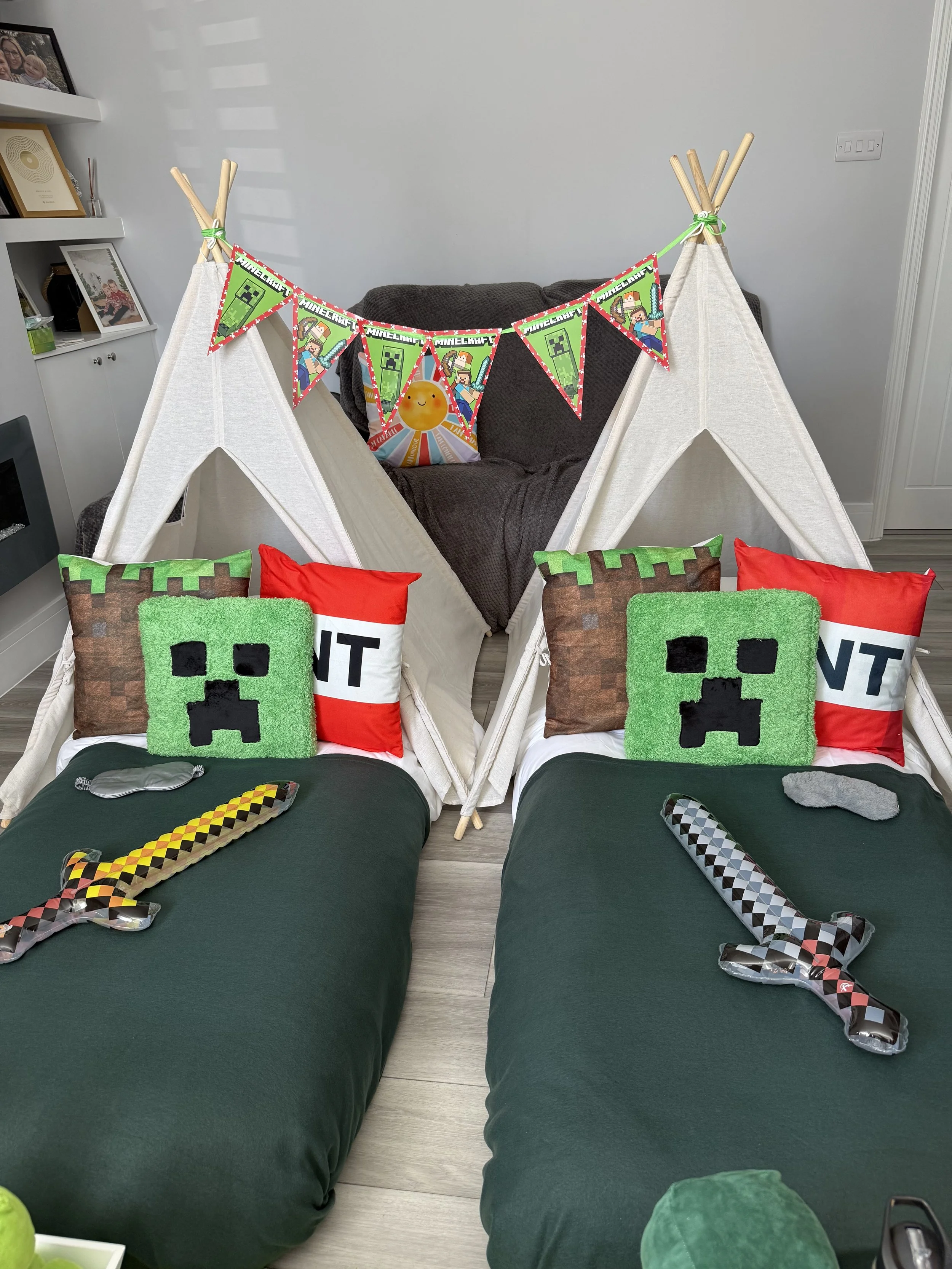 Finished Minecraft teepee sleepover with two beds, Creeper cushions, foam swords and Minecraft bunting by Sweet Dreams Events in Surrey