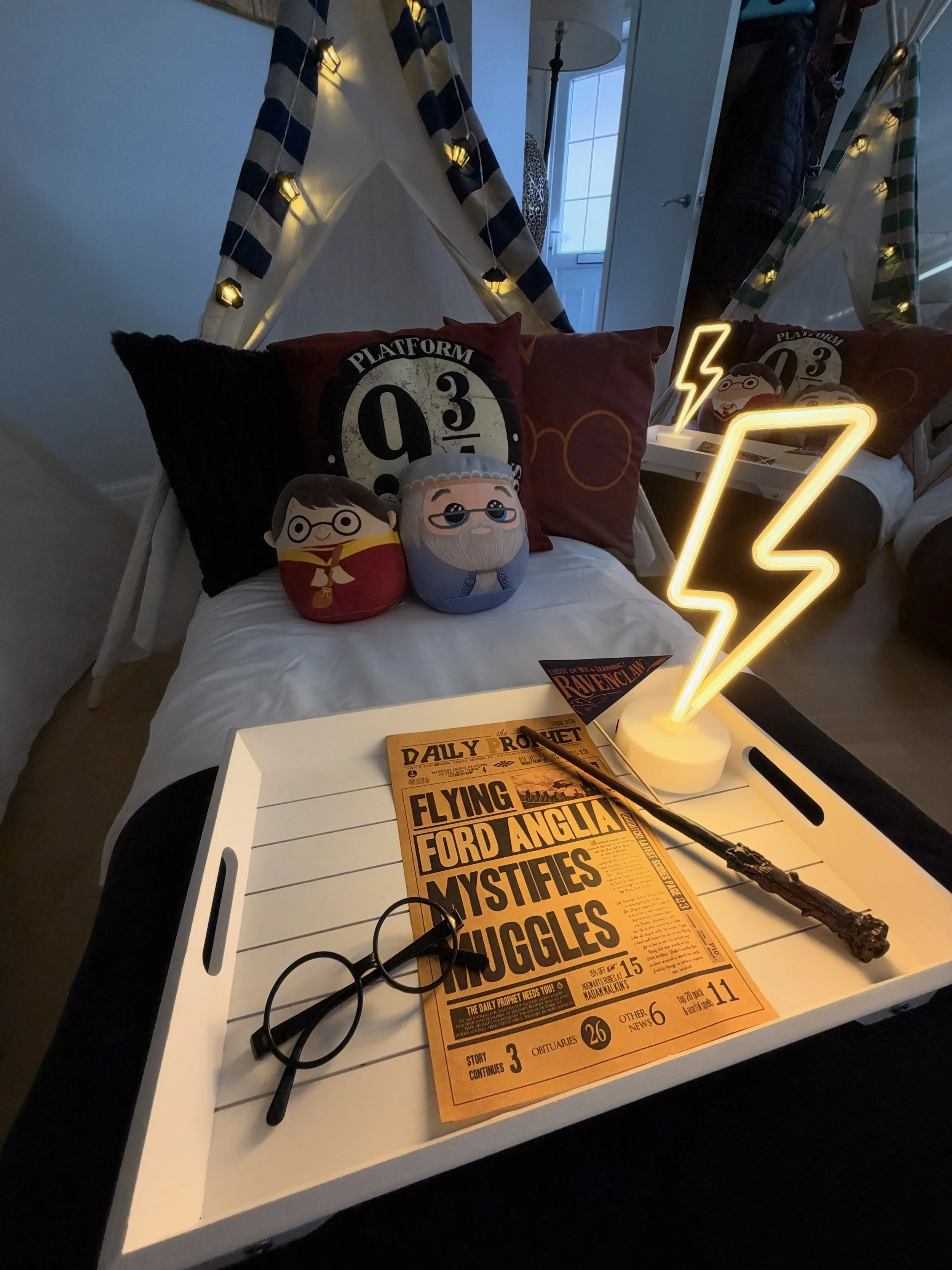 Settled in and ready for an evening of spells, snacks and stories, with each tray lit by its own lightning lamp.